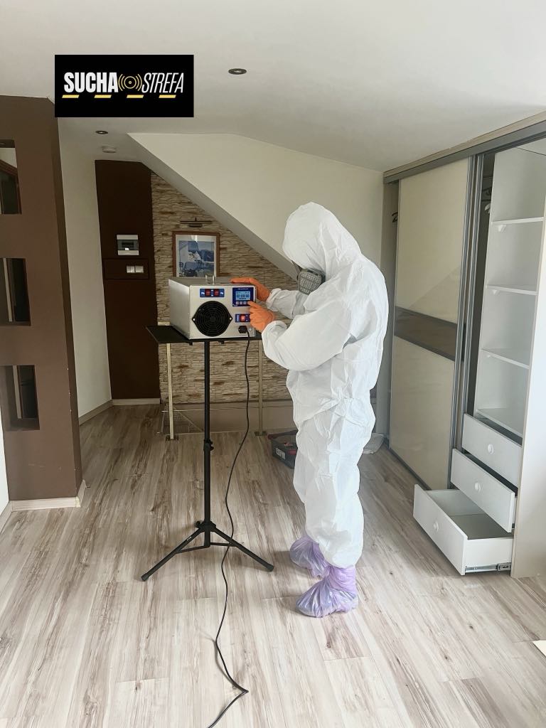 real photo of a man who sets machines to dry the walls